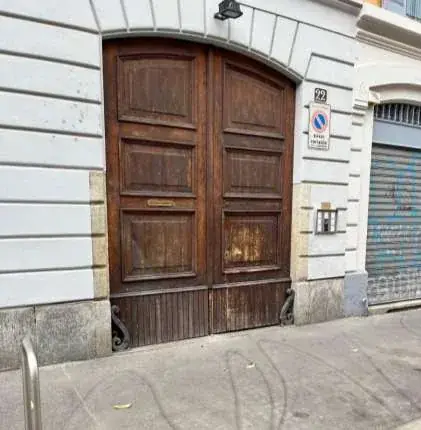 At the building entrance, tap “Open the building door” in this guide and wait for it to open. You do not need an app or a code for the building door. After tapping the button, wait about 10 seconds for the building door to open.