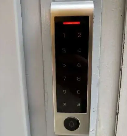Keypad on the gray door